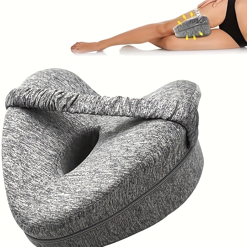 Grey leg pillow strapped between thighs demonstrating proper posture and leg alignment during sleep