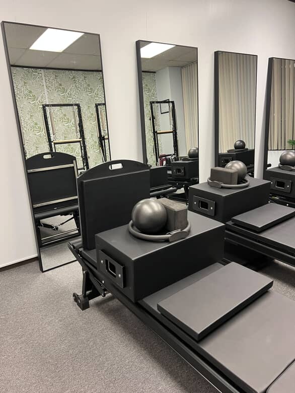 what our studio looks like, big mirrors and 4 rehab reformer machines