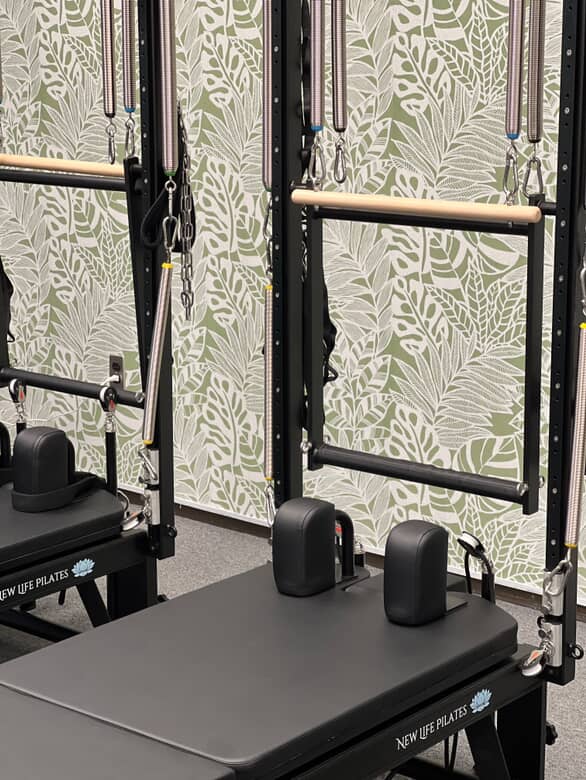 The front of a reformer pilates tower to show the machine